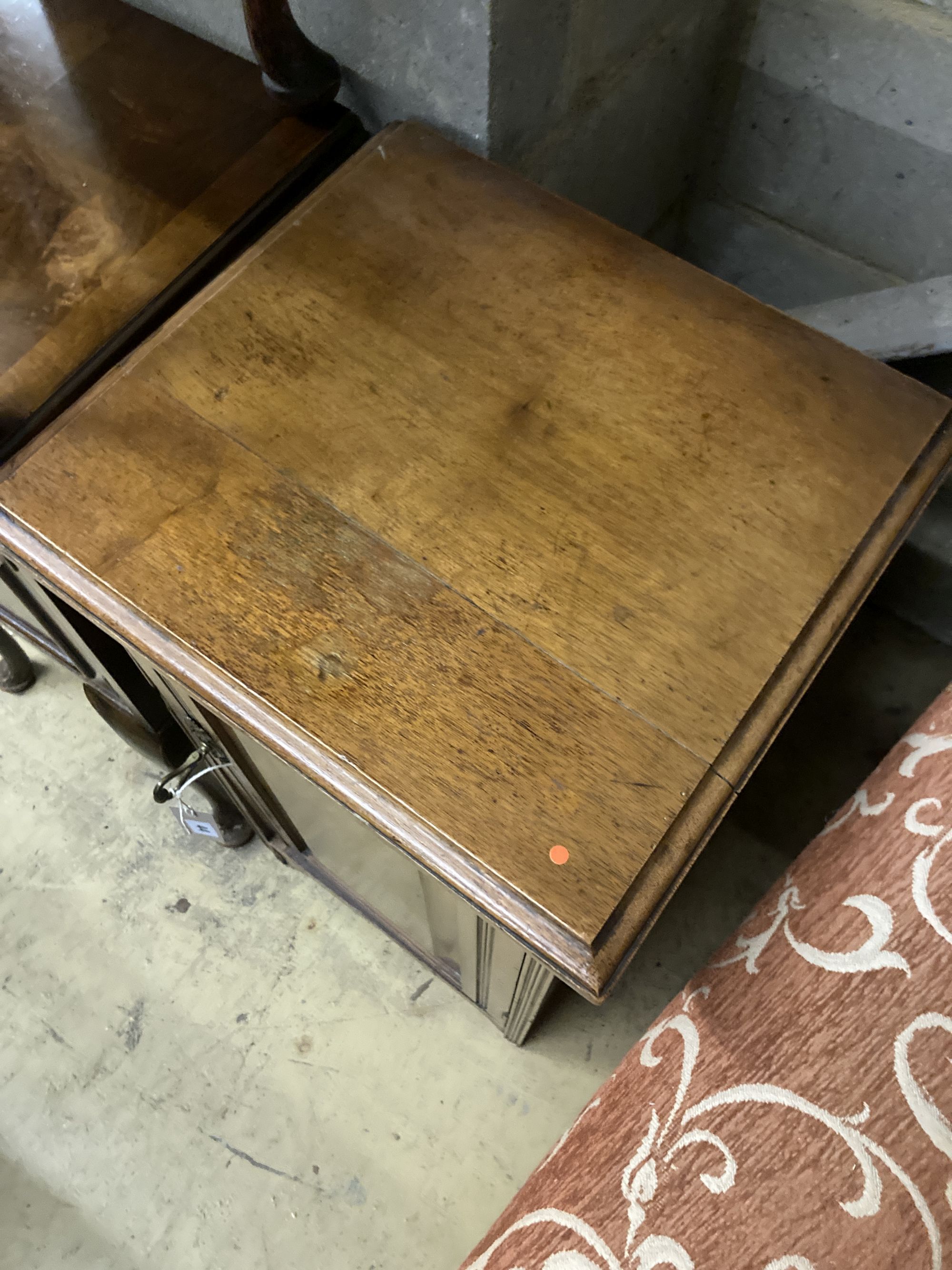 A late Victorian walnut bedside cabinet, width 40cm depth 36cm height 73cm, together with a pair of Queen Anne Revival walnut bedside c